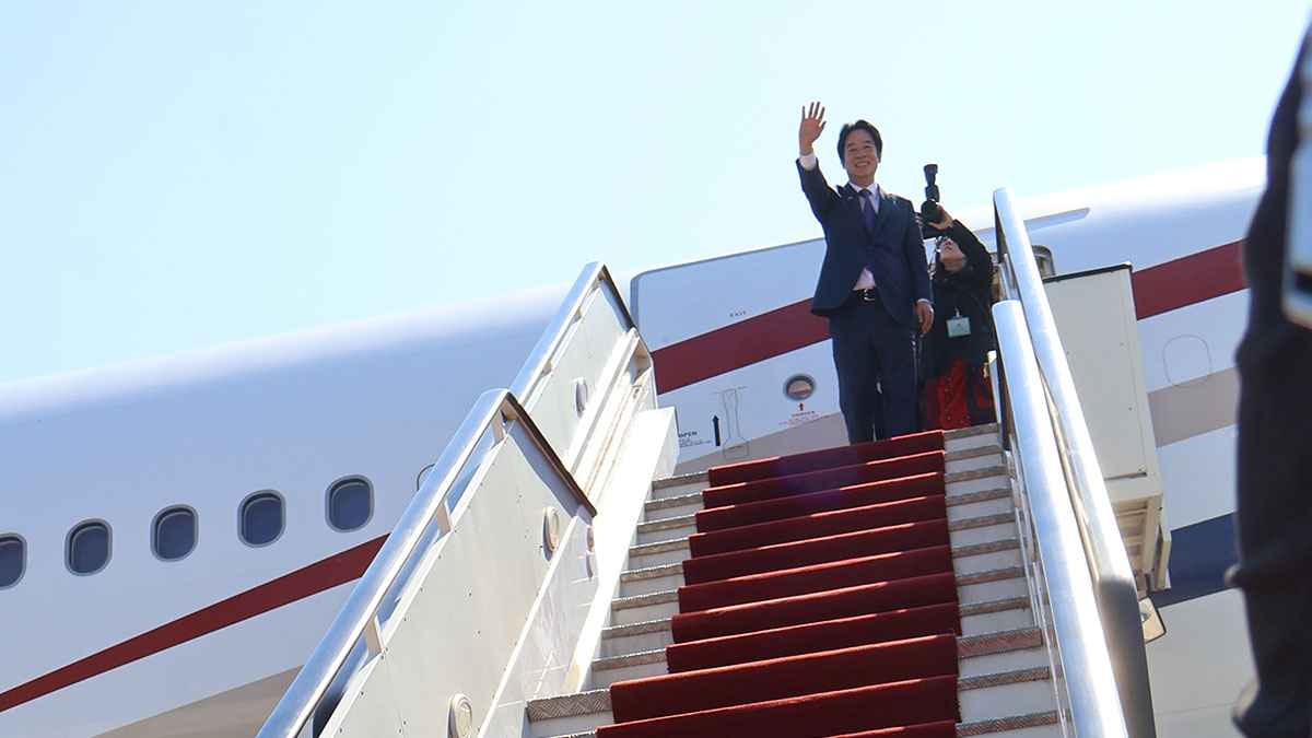 Taiwanese President Lai Ching-te waving to well wishers before departing from the country at the KMIII International Airport.